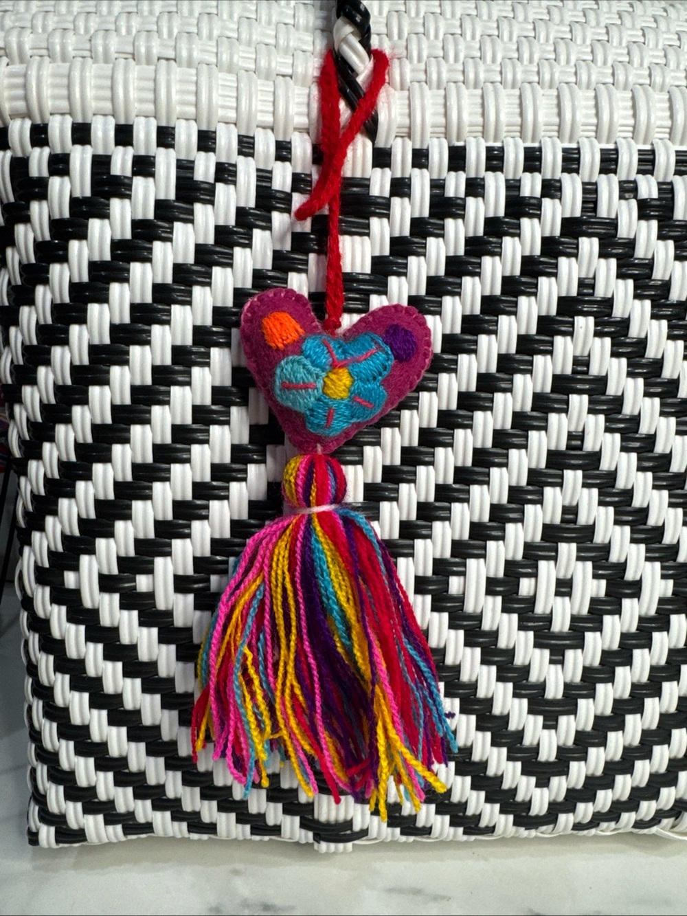 Handmade Mexican folk art heart magenta embroidered tassel bag charm